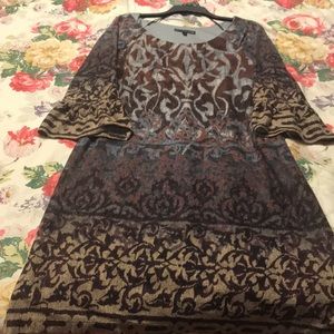 Multicolored dress with puff sleeves.